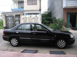 Cần Bán Ford Laser 1.8 ghia màu đen số Tự động cuối 2004, xe còn rất mới