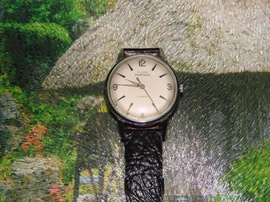 Đồng hồ đeo tay nam lên giây, hiệu ELGIN (made France) xưa. nguyên zin rất đẹp.