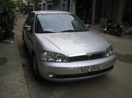 Ford Laser deluxe đời 2002, màu xám bạc, 4 máy 1. 6, phun xăng điện tử, đèn ống,