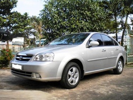 Cần bán Lacetti 30/ 12/ 2009, chất lượng 99%, màu xám bạc,